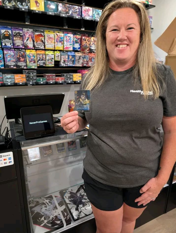 A NeverProGames staff member at the counter