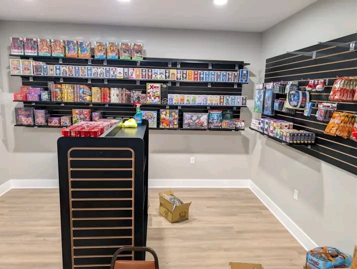 The trading card wall and checkout counter